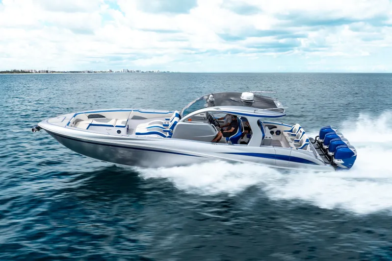  Yacht Photos Pics 2019 Deep Impact 399 Sport boat speeding on open water, showcasing sleek design and powerful engines.