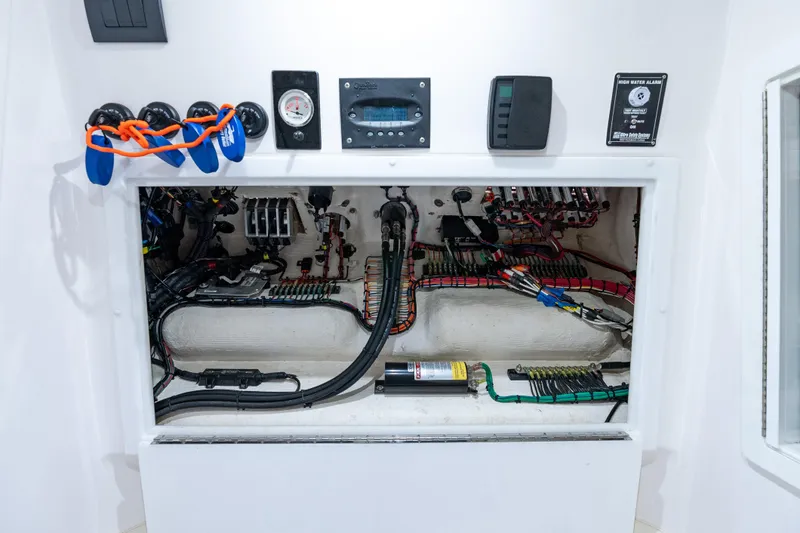  Yacht Photos Pics Electrical panel of a 2019 Deep Impact 399 Sport boat, showcasing wiring and controls.