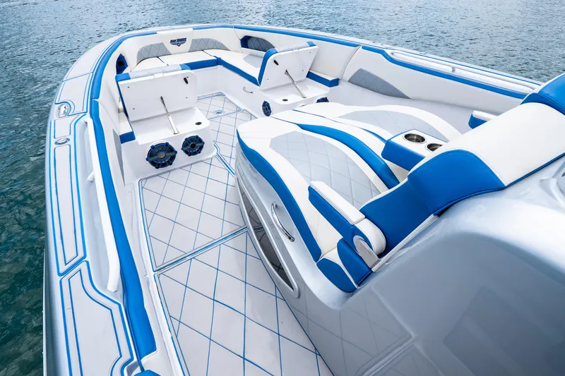  Yacht Photos Pics 2019 Deep Impact 399 Sport boat interior with blue and white seating on water.