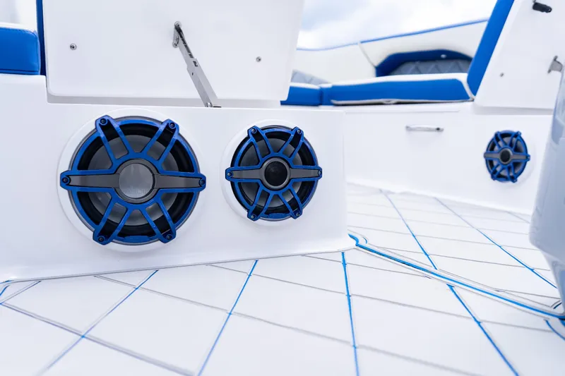  Yacht Photos Pics 2019 Deep Impact 399 Sport boat interior with blue speakers and seating.