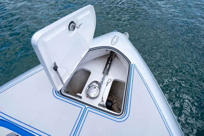  Yacht Photos Pics Open anchor compartment on 2019 Deep Impact 399 Sport boat, floating on water.