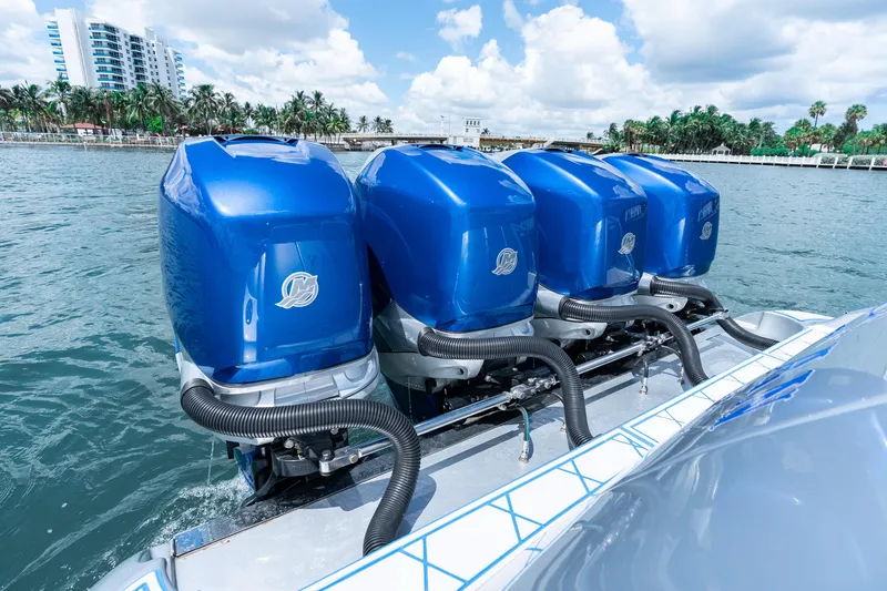  Yacht Photos Pics 2019 Deep Impact 399 Sport boat with four blue outboard engines on water.