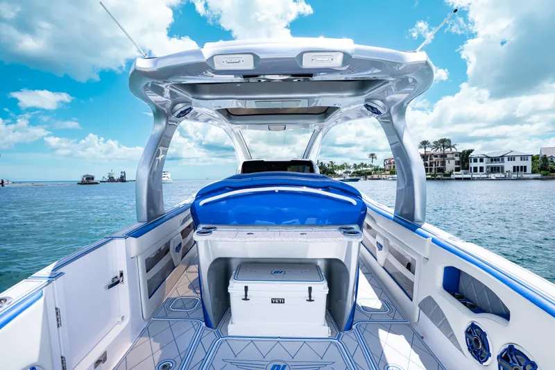  Yacht Photos Pics 2019 Deep Impact 399 Sport boat interior with blue accents on a sunny day.