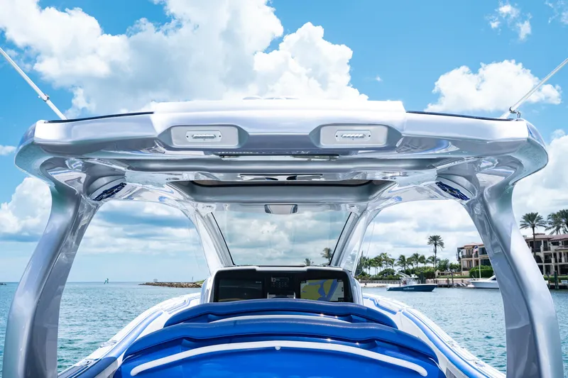  Yacht Photos Pics 2019 Deep Impact 399 Sport boat with sleek design, under a bright blue sky.