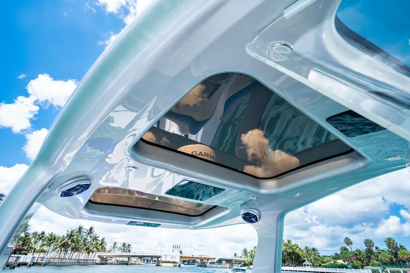  Yacht Photos Pics 2019 Deep Impact 399 Sport boat roof with sky reflection, showcasing modern design.
