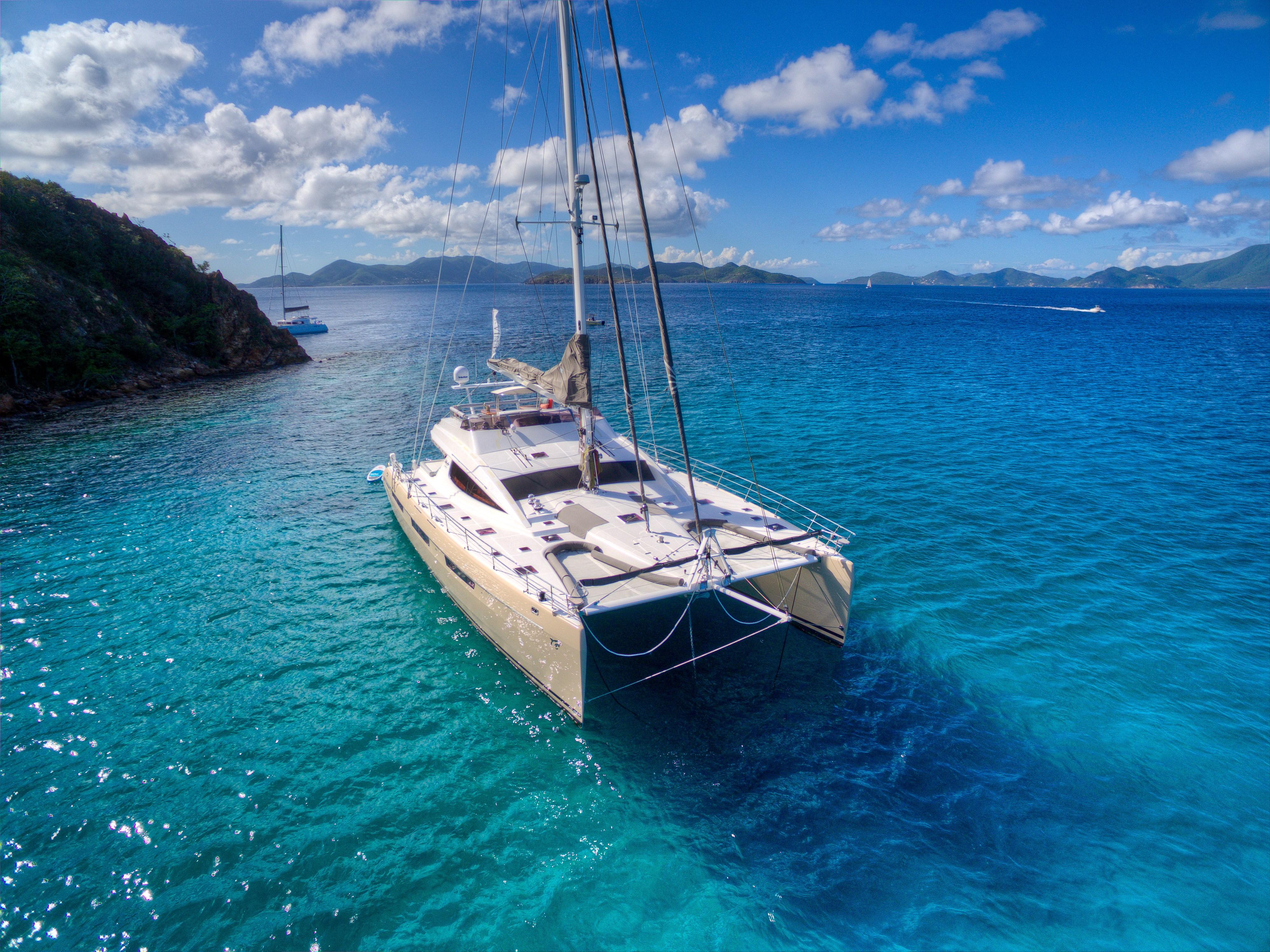 Luxury Privilege 745 catamaran sailing in clear blue waters, 2010 model.