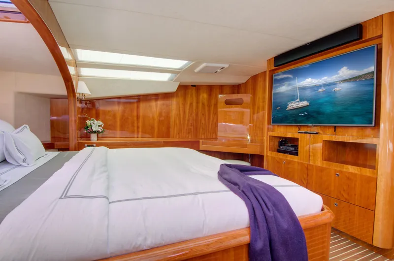  Yacht Photos Pics Luxurious bedroom in 2010 Privilege 745 yacht with TV and skylight.