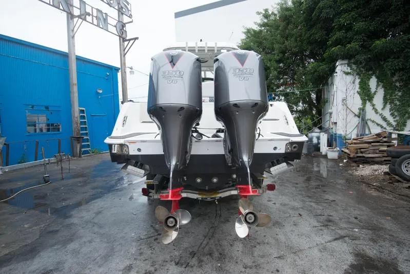  Yacht Photos Pics 2006 Hydra-Sports Vector 3300 VX with twin outboard engines in a boatyard.