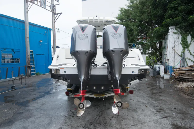  Yacht Photos Pics 2006 Hydra-Sports Vector 3300 VX with twin outboard engines in a boatyard.