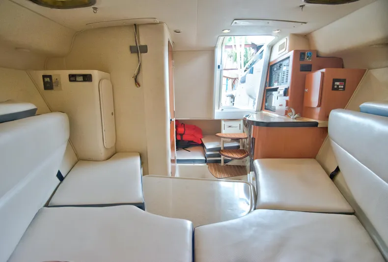  Yacht Photos Pics 2006 Hydra-Sports Vector 3300 VX cabin interior with seating and kitchenette.