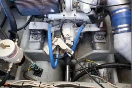 Engine compartment of a 1999 Mainship Pilot 30 boat, featuring various mechanical components.