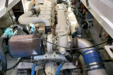 1999 Mainship Pilot 30 engine compartment with visible components and piping.
