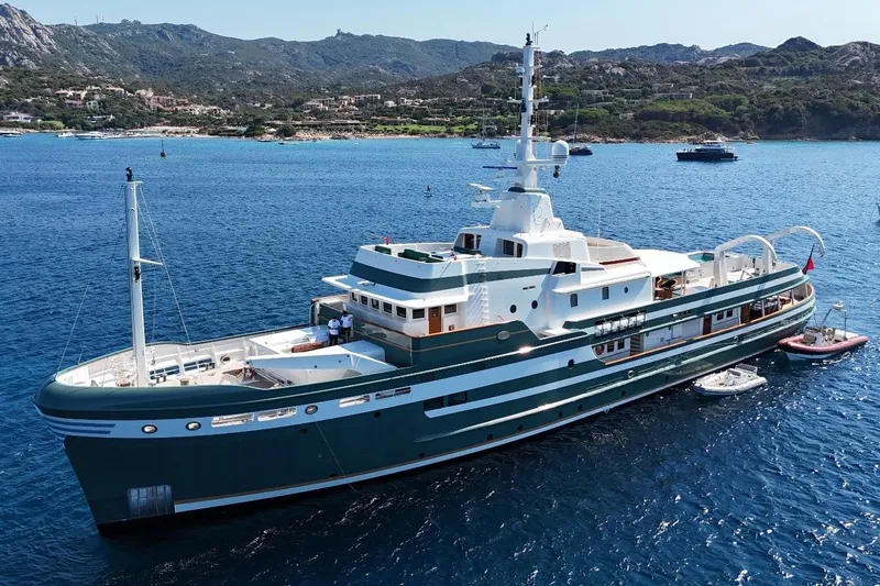 Steel Yacht Photos Pics Luxurious 2009 Pendennis 55 yacht anchored in scenic coastal waters.