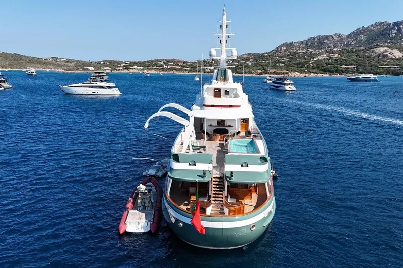 Steel Yacht Photos Pics Luxurious Pendennis 55 yacht from 2009 anchored in scenic blue waters.