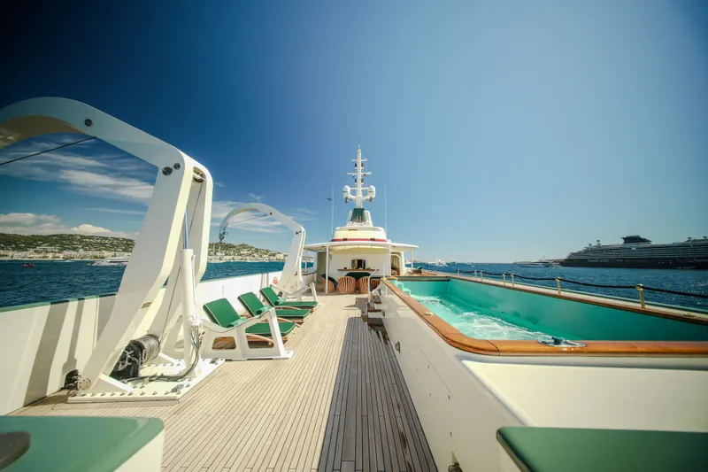 Steel Yacht Photos Pics Luxurious Pendennis 55 yacht deck with pool, 2009 model, cruising on a sunny day.