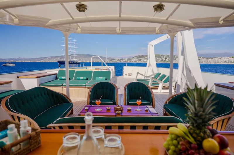 Steel Yacht Photos Pics Luxurious Pendennis 55 yacht deck with seating, drinks, and ocean view, built in 2009.