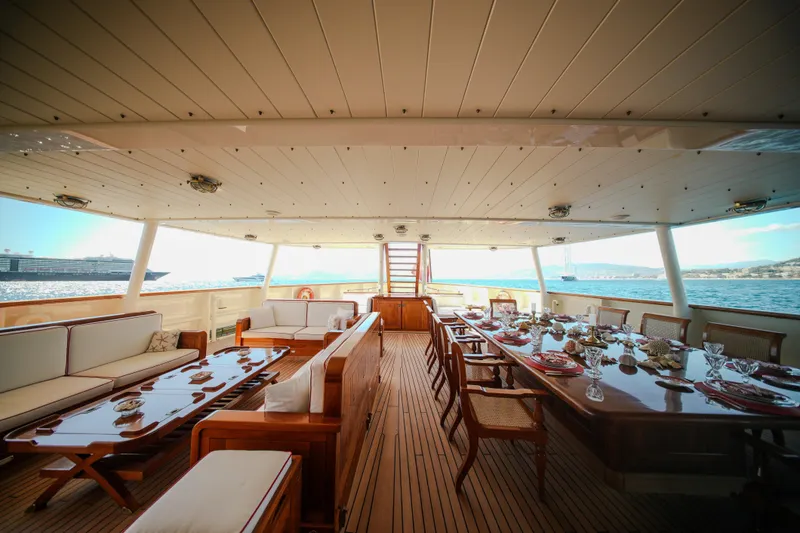 Steel Yacht Photos Pics Luxurious interior of 2009 Pendennis 55 yacht with elegant dining and seating area.