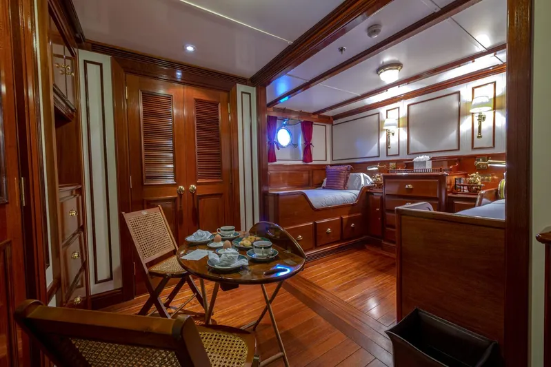 Steel Yacht Photos Pics Luxurious Pendennis 55 yacht cabin interior, 2009 model, featuring elegant wood finishes and cozy seating.