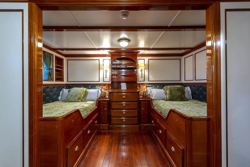 Steel Yacht Photos Pics Luxurious twin cabin interior on 2009 Pendennis 55 yacht, featuring elegant wood finishes.