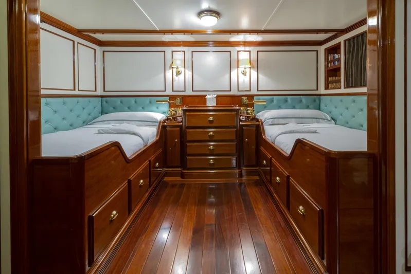 Steel Yacht Photos Pics Luxurious twin cabin with wooden furnishings on a 2009 Pendennis 55 yacht.
