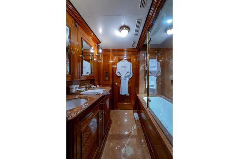 Steel Yacht Photos Pics Luxurious Pendennis 55 yacht bathroom, 2009 model, featuring elegant wood and marble finishes.