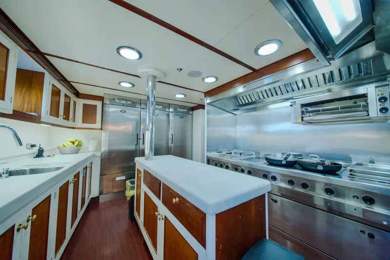 Steel Yacht Photos Pics Luxurious yacht kitchen with stainless steel appliances, wooden cabinets, and modern lighting, Pendennis 55, 2009.