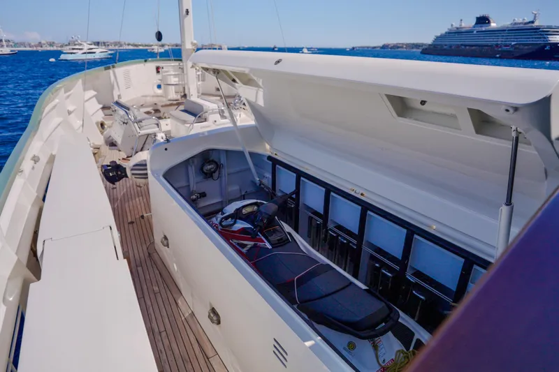 Steel Yacht Photos Pics Luxury Pendennis 55 yacht deck with open storage, 2009 model, docked on blue ocean.