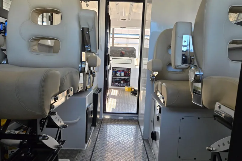  Yacht Photos Pics Interior of 2025 Custom Boat 34 with modern seating and sleek design.