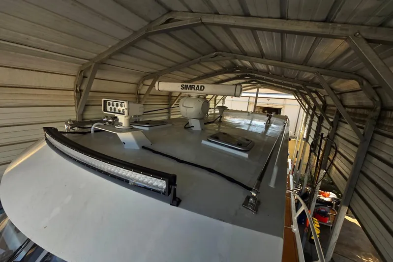  Yacht Photos Pics Rooftop view of 2025 Custom Boat 34 with radar and lighting equipment.