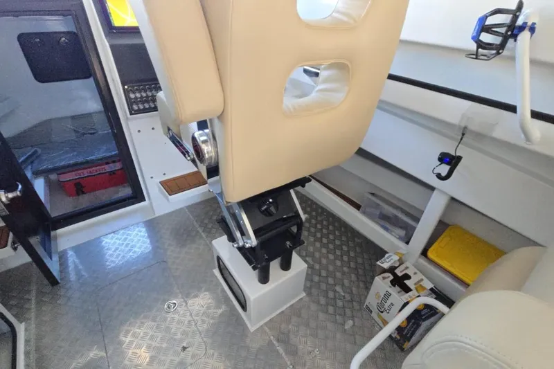  Yacht Photos Pics Interior of 2025 Custom Boat 34 with beige seating and modern controls.