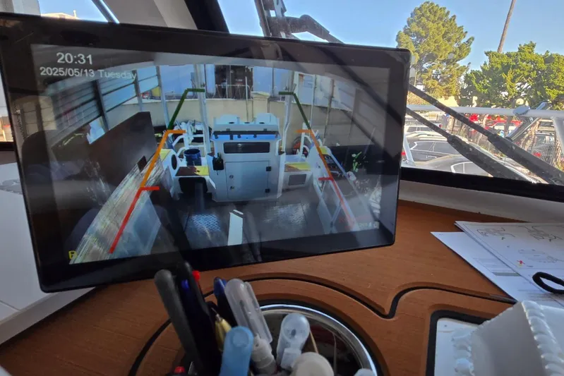  Yacht Photos Pics Tablet displaying boat camera feed inside a 2025 Custom Boat model 34 cockpit.