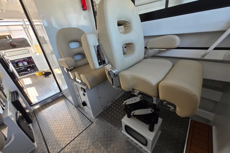  Yacht Photos Pics Luxurious interior of 2025 Custom Boat 34 with plush seating and modern design.