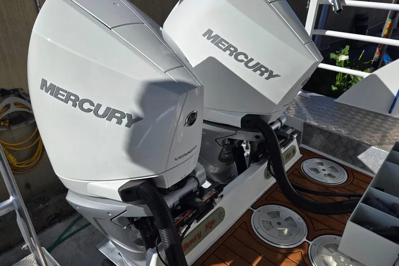  Yacht Photos Pics Twin Mercury outboard engines on a 2025 Custom Boat 34, featuring a sleek design.