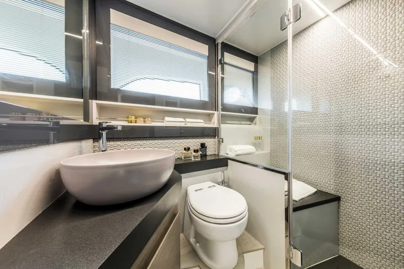 Dolcevita Yacht Photos Pics Luxurious bathroom in 2022 Pershing 5x yacht with modern fixtures and elegant design.