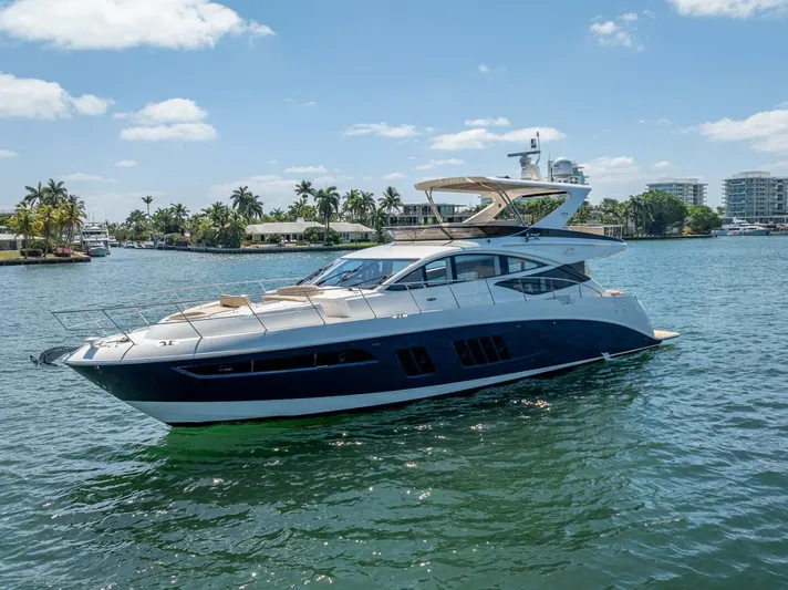  Yacht Photos Pics 2016 Sea Ray L650 Fly yacht on a sunny day, cruising in a tropical waterfront setting.