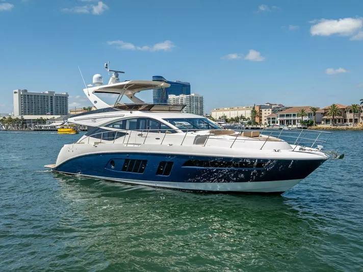  Yacht Photos Pics 2016 Sea Ray L650 Fly yacht cruising in a sunny harbor.