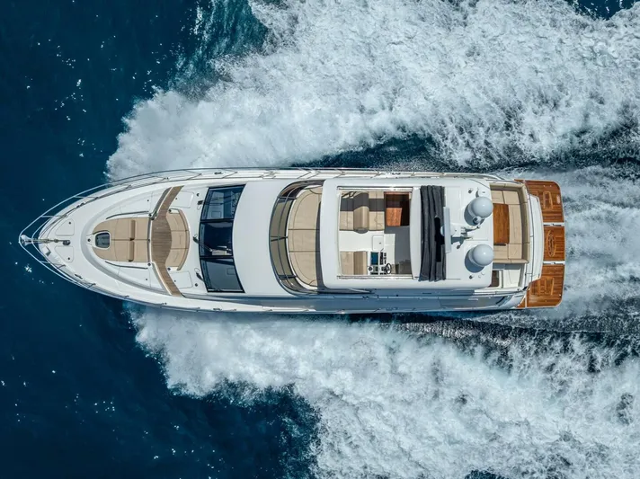  Yacht Photos Pics Aerial view of 2016 Sea Ray L650 Fly yacht cruising on the ocean.