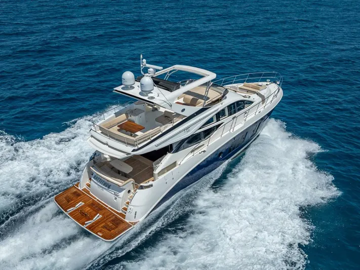  Yacht Photos Pics 2016 Sea Ray L650 Fly yacht cruising on open water, showcasing luxury and performance.