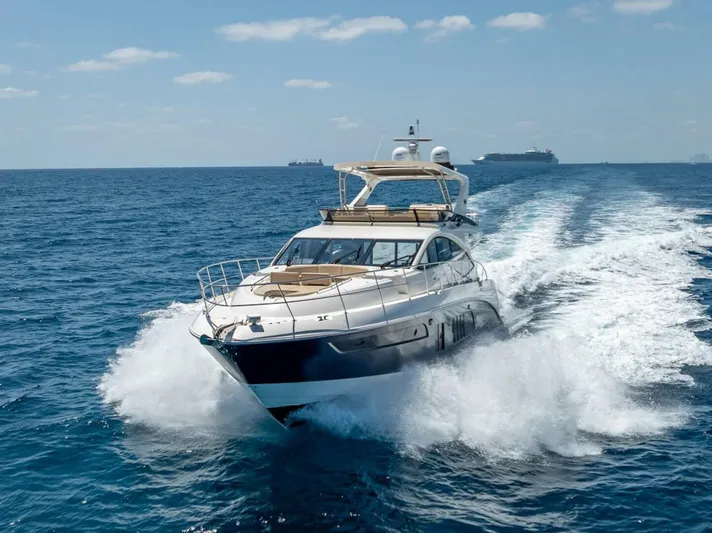  Yacht Photos Pics 2016 Sea Ray L650 Fly yacht cruising on open ocean waters.