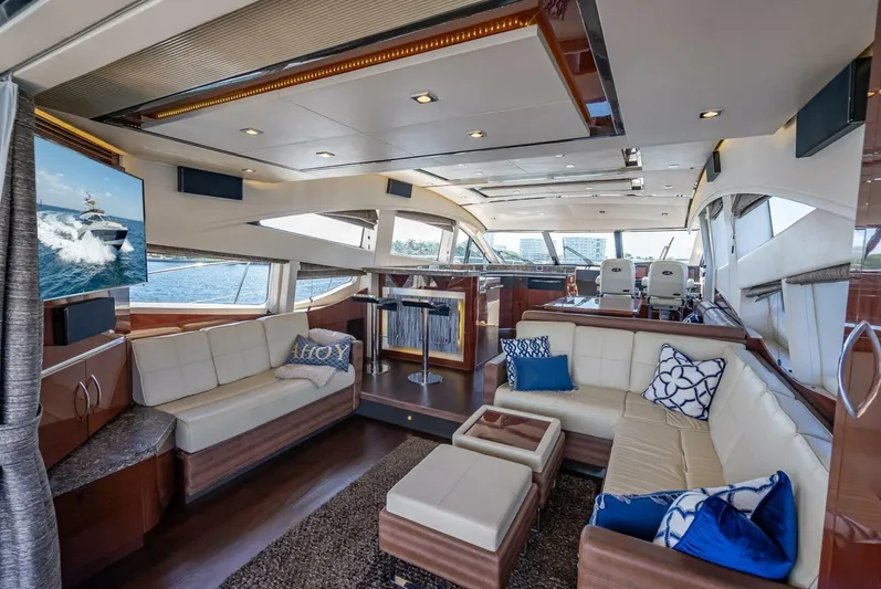  Yacht Photos Pics Luxurious interior of 2016 Sea Ray L650 Fly yacht with elegant seating and modern decor.