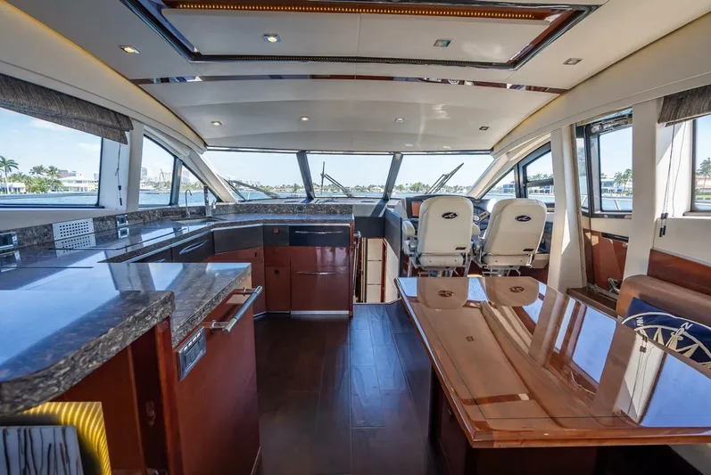  Yacht Photos Pics Luxurious interior of 2016 Sea Ray L650 Fly yacht with modern design and panoramic windows.