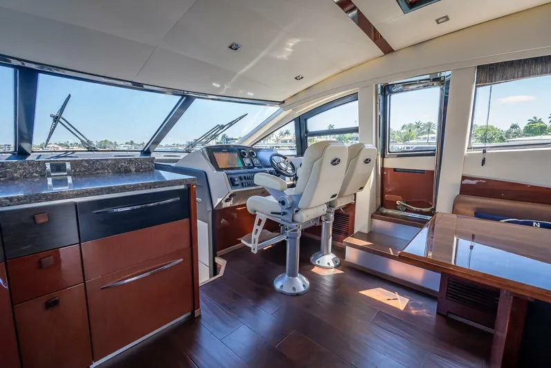  Yacht Photos Pics Luxurious interior of 2016 Sea Ray L650 Fly yacht with modern helm and seating.