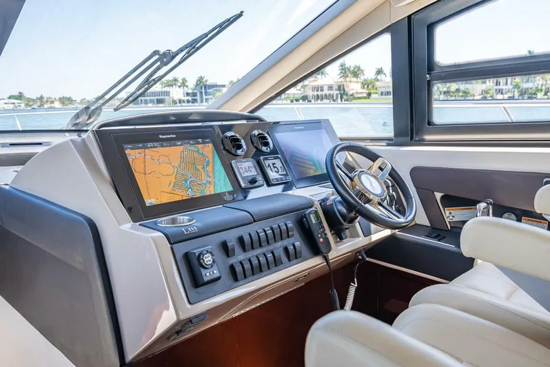  Yacht Photos Pics Luxurious helm of 2016 Sea Ray L650 Fly yacht with advanced navigation systems.