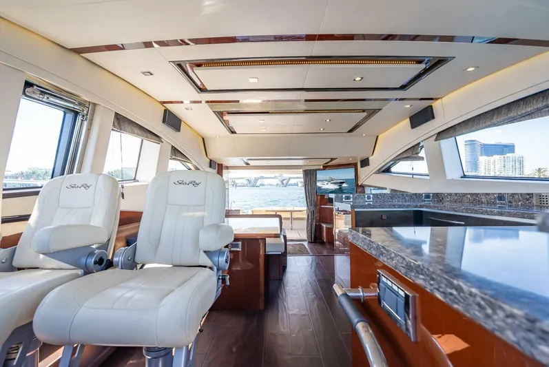  Yacht Photos Pics Luxurious interior of 2016 Sea Ray L650 Fly yacht with modern design and panoramic windows.