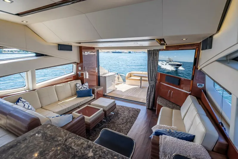  Yacht Photos Pics Luxurious interior of 2016 Sea Ray L650 Fly yacht with spacious seating and ocean view.