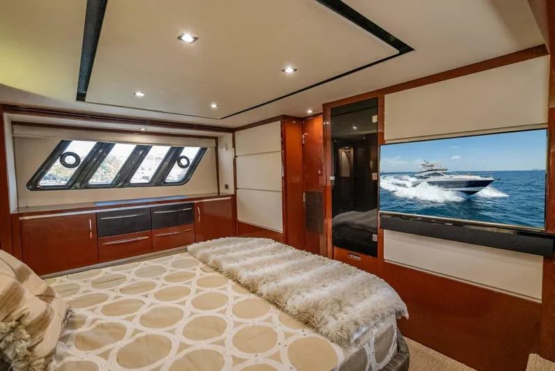  Yacht Photos Pics Luxurious bedroom interior of 2016 Sea Ray L650 Fly yacht with modern design and ocean view.