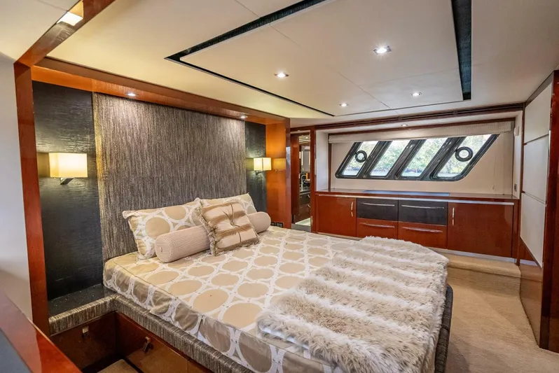  Yacht Photos Pics Luxurious bedroom interior of 2016 Sea Ray L650 Fly yacht with elegant decor.