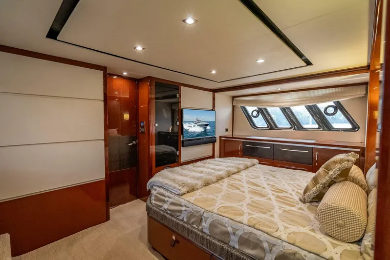  Yacht Photos Pics Luxurious bedroom interior of 2016 Sea Ray L650 Fly yacht with elegant furnishings.