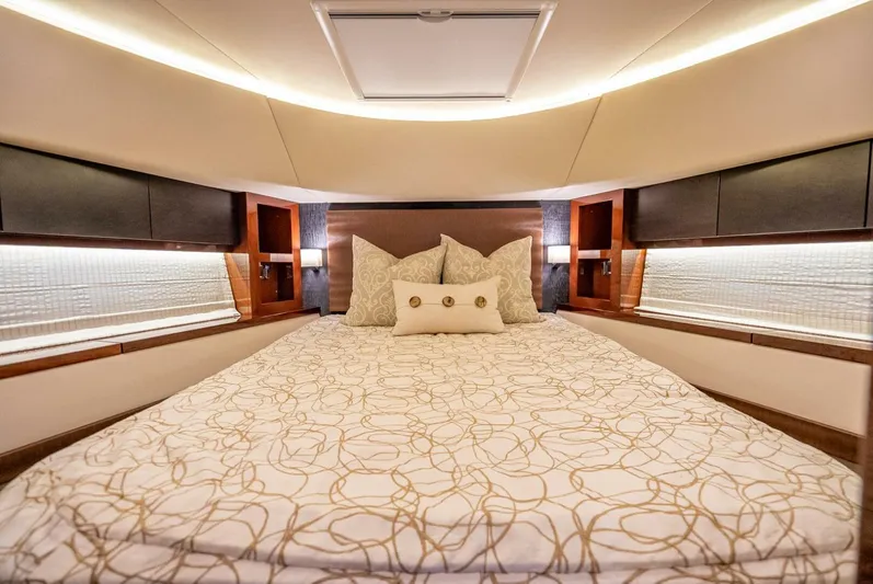  Yacht Photos Pics Luxurious bedroom interior of 2016 Sea Ray L650 Fly yacht with elegant bedding.