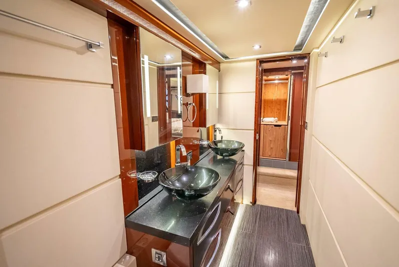  Yacht Photos Pics Luxurious bathroom interior of 2016 Sea Ray L650 Fly yacht with dual glass sinks.